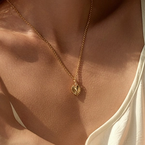 18K gold plated necklace with a sunburst heart pendant and small sparkling zircon accent