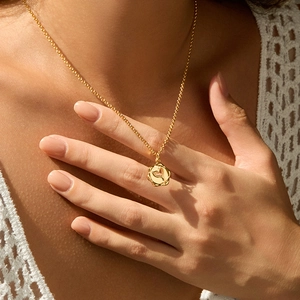 18K gold plated copper necklace with irregular circular pendant worn by model