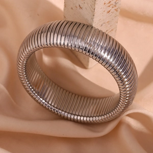 Detailed shot of 20mm wide silver textured snake chain bracelet on a stone display
