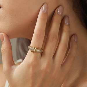 Close-up of 18K gold-plated starfish ring with cubic zirconia on female hand