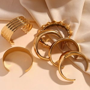 5-piece set of 18K gold-plated stainless steel bangles featuring textured bamboo and minimalist designs