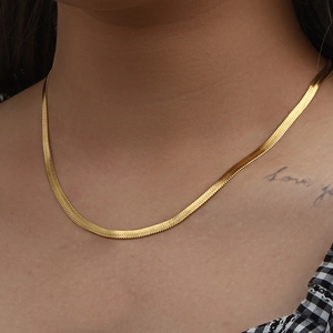 Elegant 18K gold plated herringbone snake chain necklace on female model neck