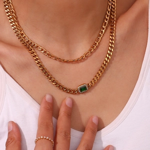 Elegant gold double layer necklace set featuring a green rectangle zircon stone pendant