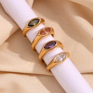 Detailed view of four 18K gold plated rings with marquise-cut colorful zircon stones