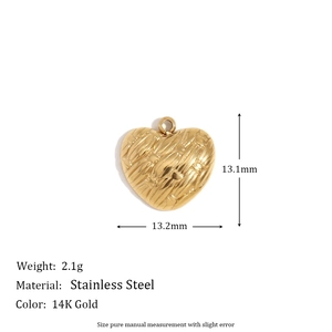 Detailed macro of 14K gold-plated stainless steel heart pendant with woven texture