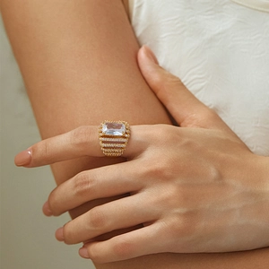 Luxurious 18K gold plated ring with large zircon stone and pavé setting on hand