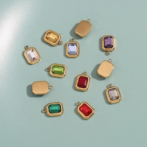 Detail showing various colors of rectangular 18K gold plated glass stone pendants