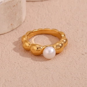 Detailed view of 18K gold plated hollow wave ring featuring a white round pearl inlay