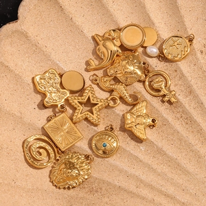 Detailed view of assorted 18K gold plated charms with starfish and lion motifs