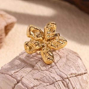 Macro shot of 18K gold plated flower ring with unique molten lava textured petals