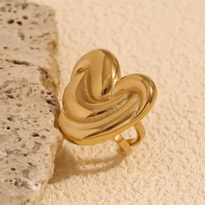 Detail showing gold heart ring with melted molten texture and 18K gold plated finish