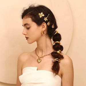 18K gold plated butterfly wing hair tie and heart pendant jewelry set on model