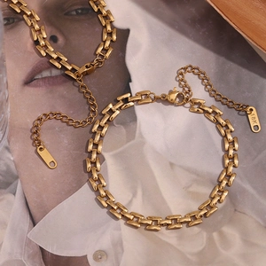 Detailed close-up of 18K gold plated stainless steel square link chain with lobster clasp