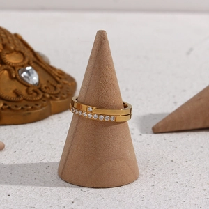 Detail of 18K gold plated minimalist rings featuring round and pavé cubic zirconia accents