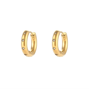 Detail of gold-plated hoop earrings with star-shaped engravings and cubic zirconia