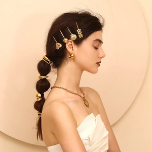 Detailed view of model wearing 18K gold plated double-layer water drop hair rope and accessories