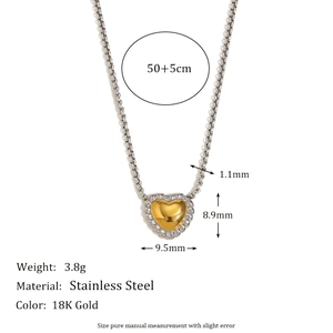 18K gold heart necklace with twisted silver border on a 50+5cm stainless steel chain
