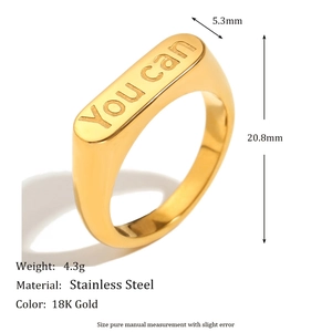 Macro view of 18K gold plated stainless steel ring featuring You Can engraved flat top