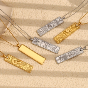 Detailed relief of vintage 18K gold zodiac pendant with sparkling zircon accent