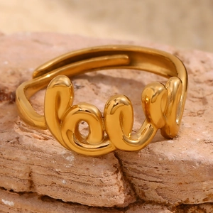 Detailed view of 18K gold plated stainless steel ring featuring cursive LOVE design