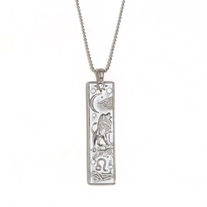 Silver Leo zodiac pendant necklace with embossed lion and star details on ball chain