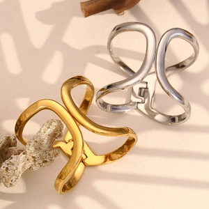 Polished 18K gold and silver plated stainless steel geometric bangles in a sleek design