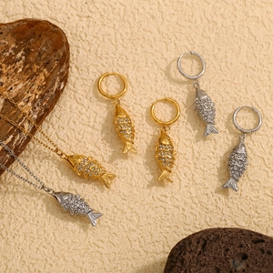 Gold and silver koi fish necklace and earring set with shimmering white crystals