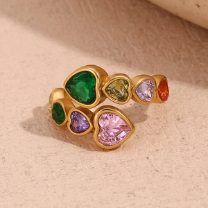 Macro detail of 18K gold-plated open ring with multi-colored heart-shaped zircon stones