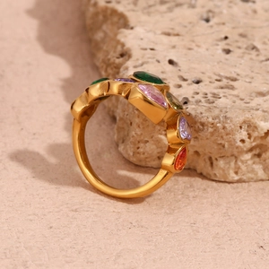 Macro detail of 18K gold plated ring featuring colorful teardrop zircon gemstones