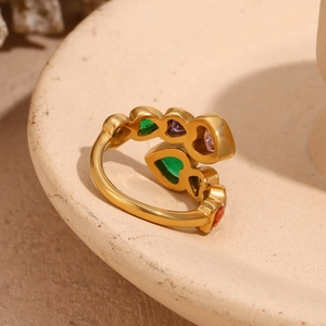 Detail of 18K gold-plated open ring featuring vibrant multi-colored heart zircons