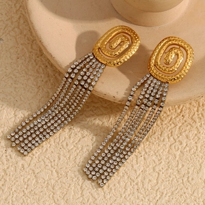 Detail of 18K gold plated tassel earrings with sparkling rhinestones on ceramic base