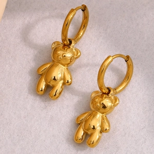 Detailed close-up of 18K gold plated stainless steel teddy bear charm hoop earrings