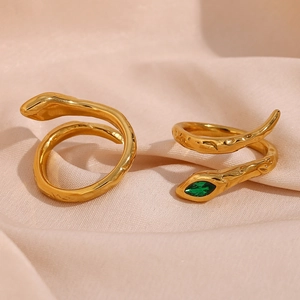 Snake rings set with 18K gold plating and emerald eye on textured stainless steel