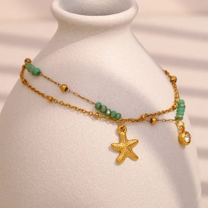 Zweilagiges 18K vergoldetes Seestern-Armband mit grünen Perlen und Zirkonia-Anhängern