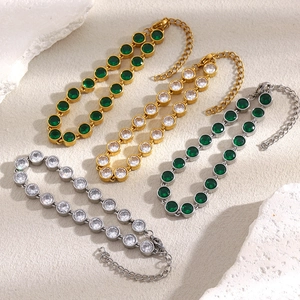 Selection of 18K gold and silver tennis bracelets with green and white cubic zirconia