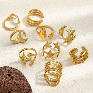 Detailed close-up of adjustable 18K gold-plated rings with star and heart designs