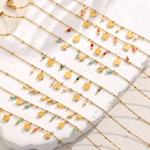 Detail of multiple 18K gold plated satellite chains with star, heart, and colorful beads