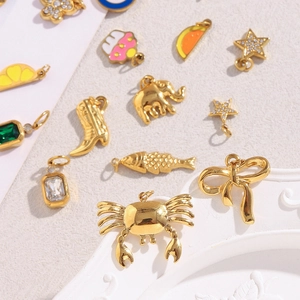 Detailed collection of 18K gold-plated charms including sea animals and geometric shapes