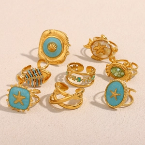 18K gold plated ocean theme rings set with starfish, seashell, and turtle designs