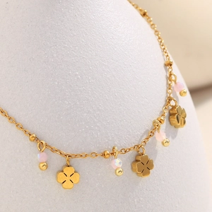 18K gold plated stainless steel bracelet featuring clover charms and pink matte beads