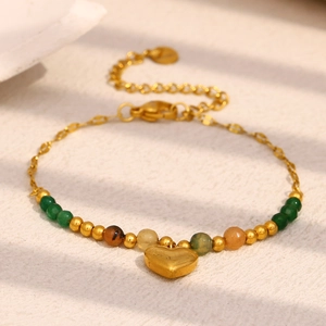 Detailed close-up of 18K gold-plated chain bracelet with multi-color beads and heart charm
