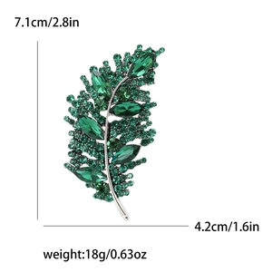 Elegant emerald green leaf brooch with crystals in silver base, 7.1cm x 4.2cm size
