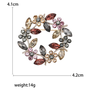 Broche couronne branche d'olivier élégante avec cristaux colorés et finition argentée