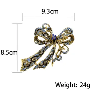 Vintage gold bow brooch with blue rhinestones, size 9.3cm x 8.5cm, weight 24g