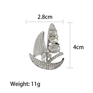 Elegant silver sailboat brooch with crystal rhinestones for women, 2.8cm width