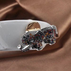 Close-up of elephant brooch converter with colorful rhinestones on silver metal