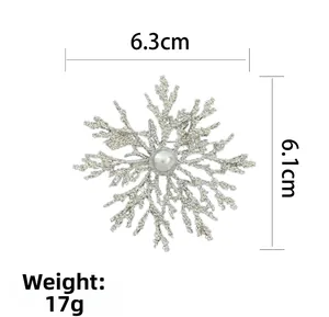 Detail shot of vintage snowflake brooch with pearl, dimensions 6.3cm by 6.1cm