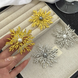 Retro snowflake brooches with matte gold and silver finish and elegant pearl centers