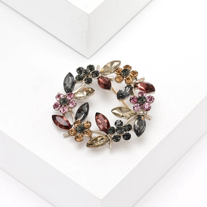 Broche couronne en cristal de branche d'olivier avec strass roses et ambre sur base argent