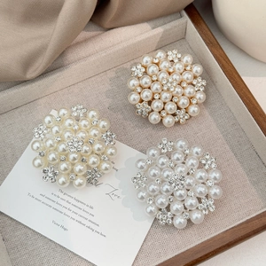 Elegant pearl and rhinestone sunflower brooch in gold and silver finish on silk